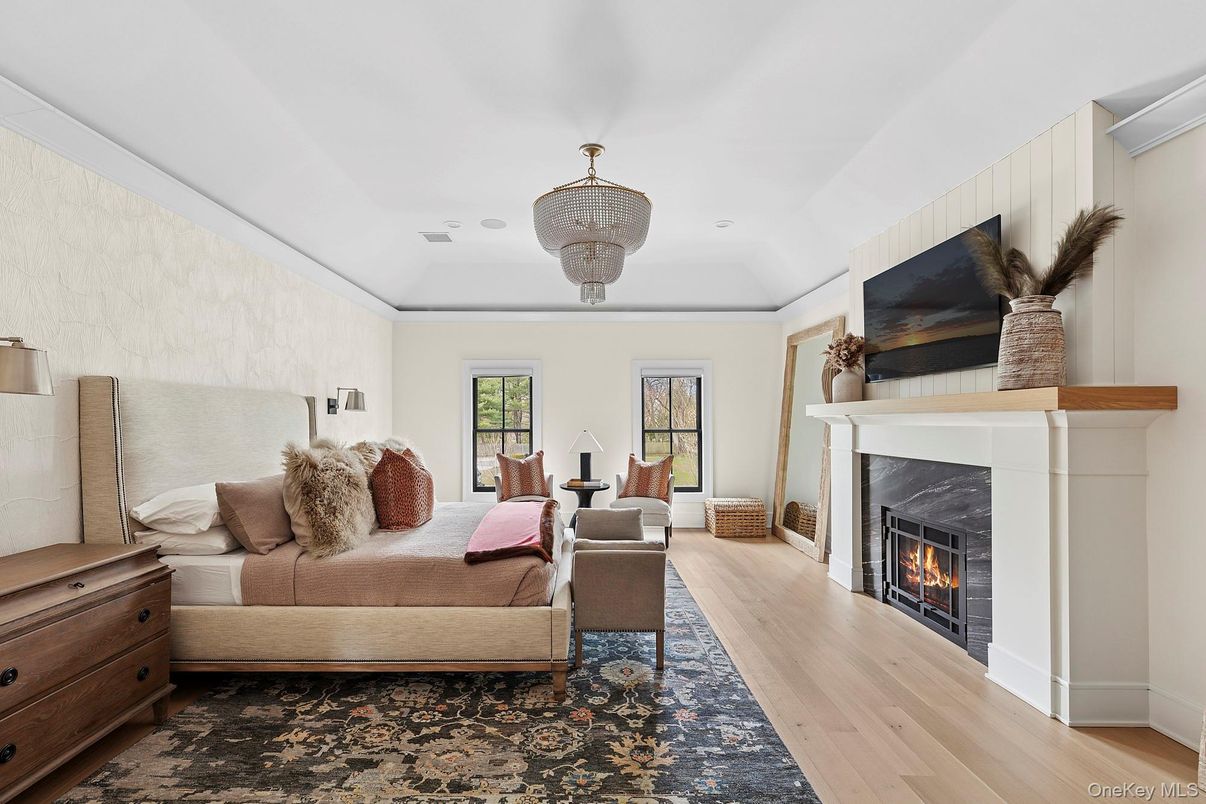 Bedroom, Chandelier, Fireplace, Interior, Recessed Lighting, Wood Texture Flooring