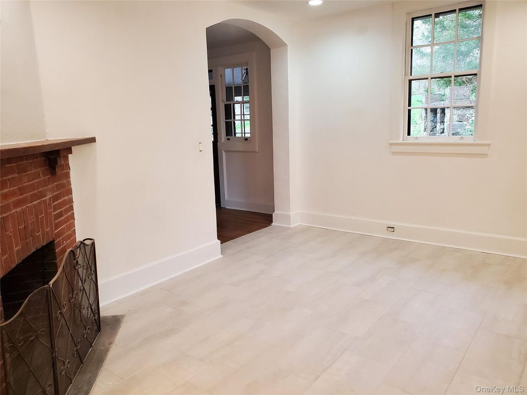 Empty room, Fireplace, Interior, Recessed Lighting, Stone Walls, Wood Texture Flooring
