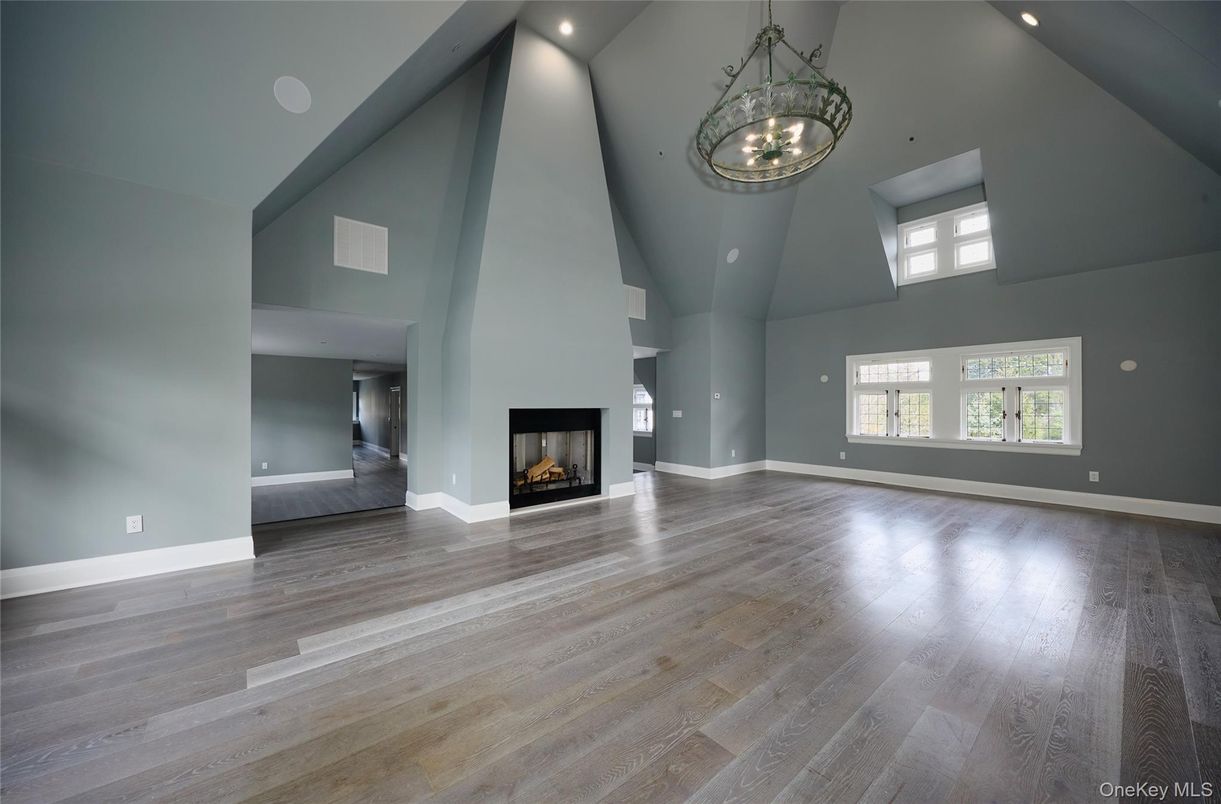 Chandelier, Empty room, Fireplace, Interior, Pendant Lights, Recessed Lighting, Wood Texture Flooring
