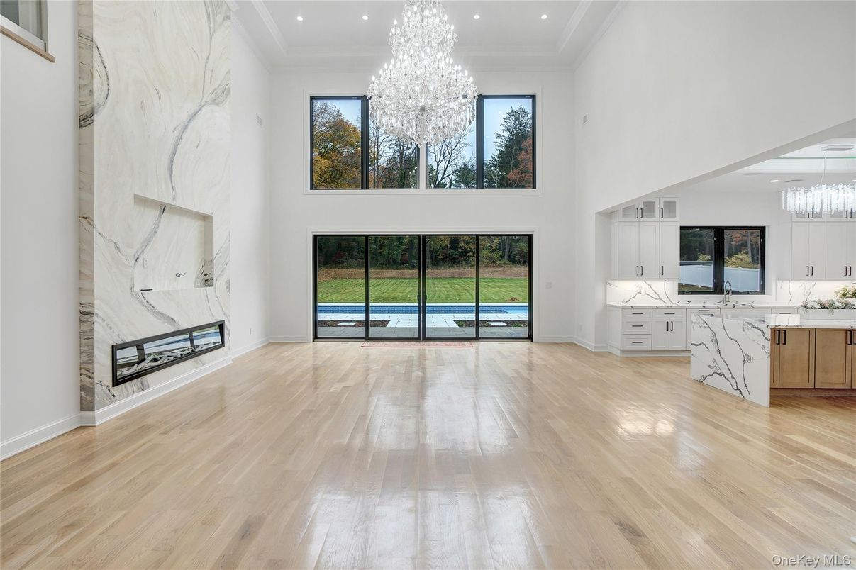 Chandelier, Fireplace, Interior, Kitchen, Marble Walls, Recessed Lighting, Wood Texture Flooring