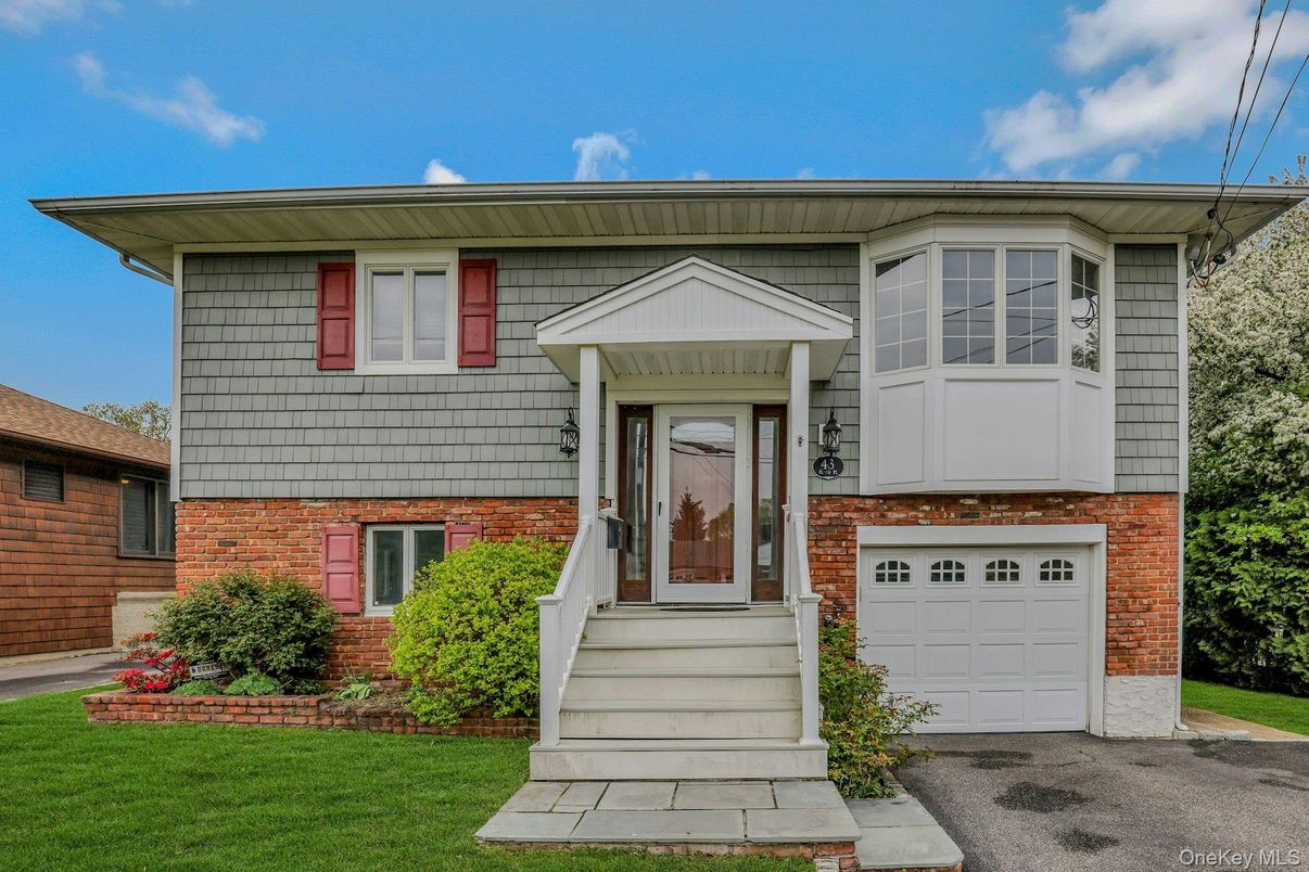 Attached, Exterior, Facade, Brick Facade, Raised Ranch