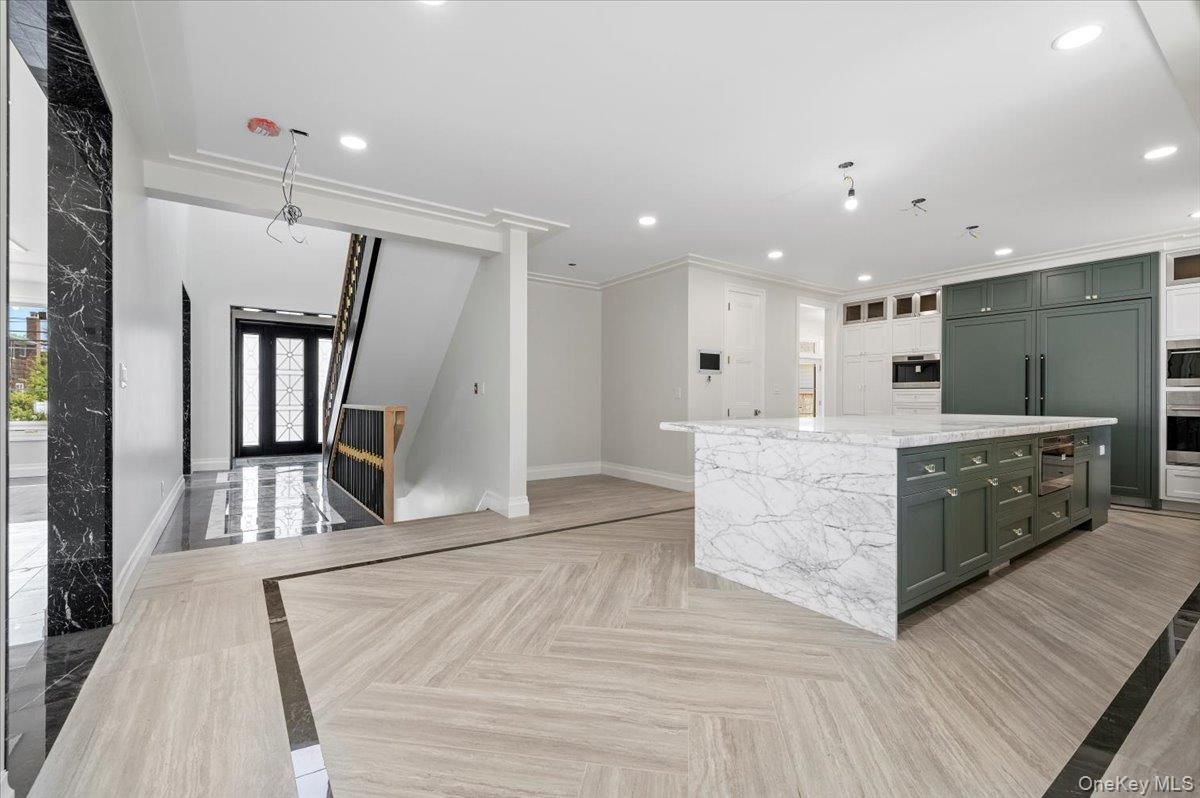 Interior, Kitchen, Marble Walls, Pendant Lights, Recessed Lighting, Stainless Steel Appliances, Wood Texture Flooring