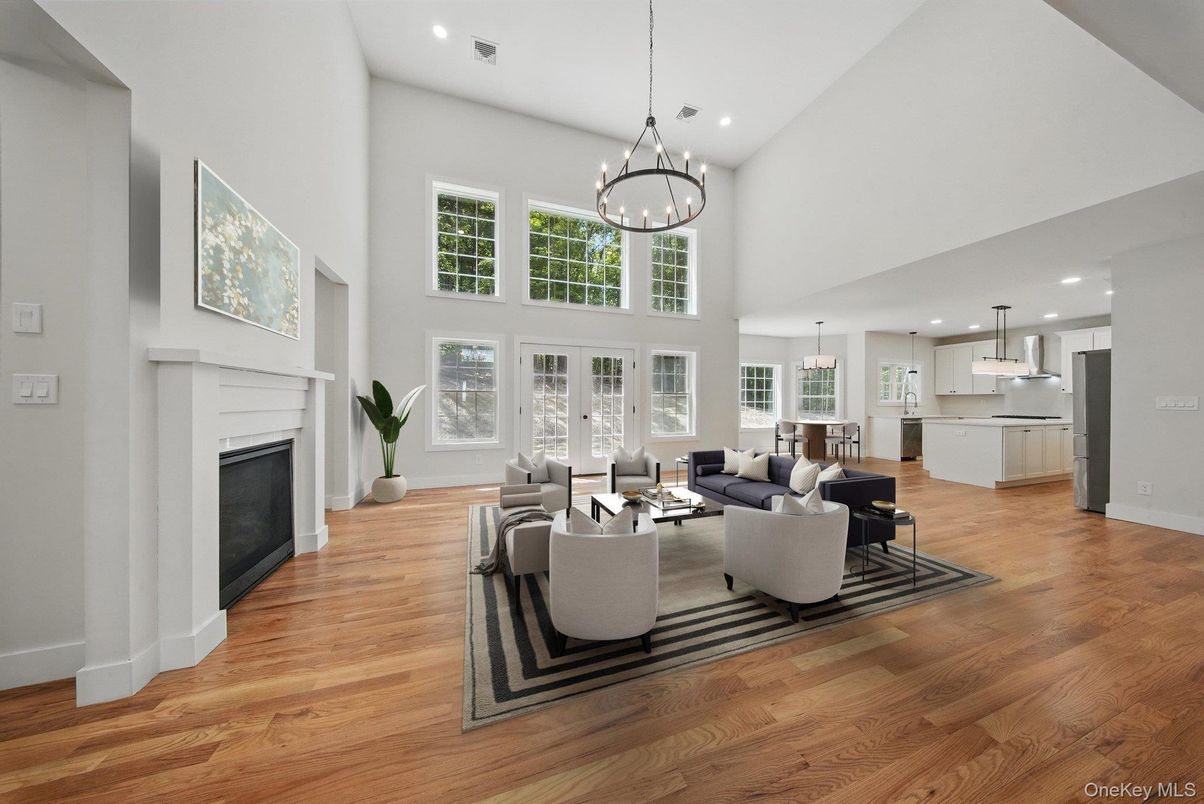 Chandelier, Fireplace, Interior, Kitchen, Living room, Pendant Lights, Recessed Lighting, Wood Texture Flooring