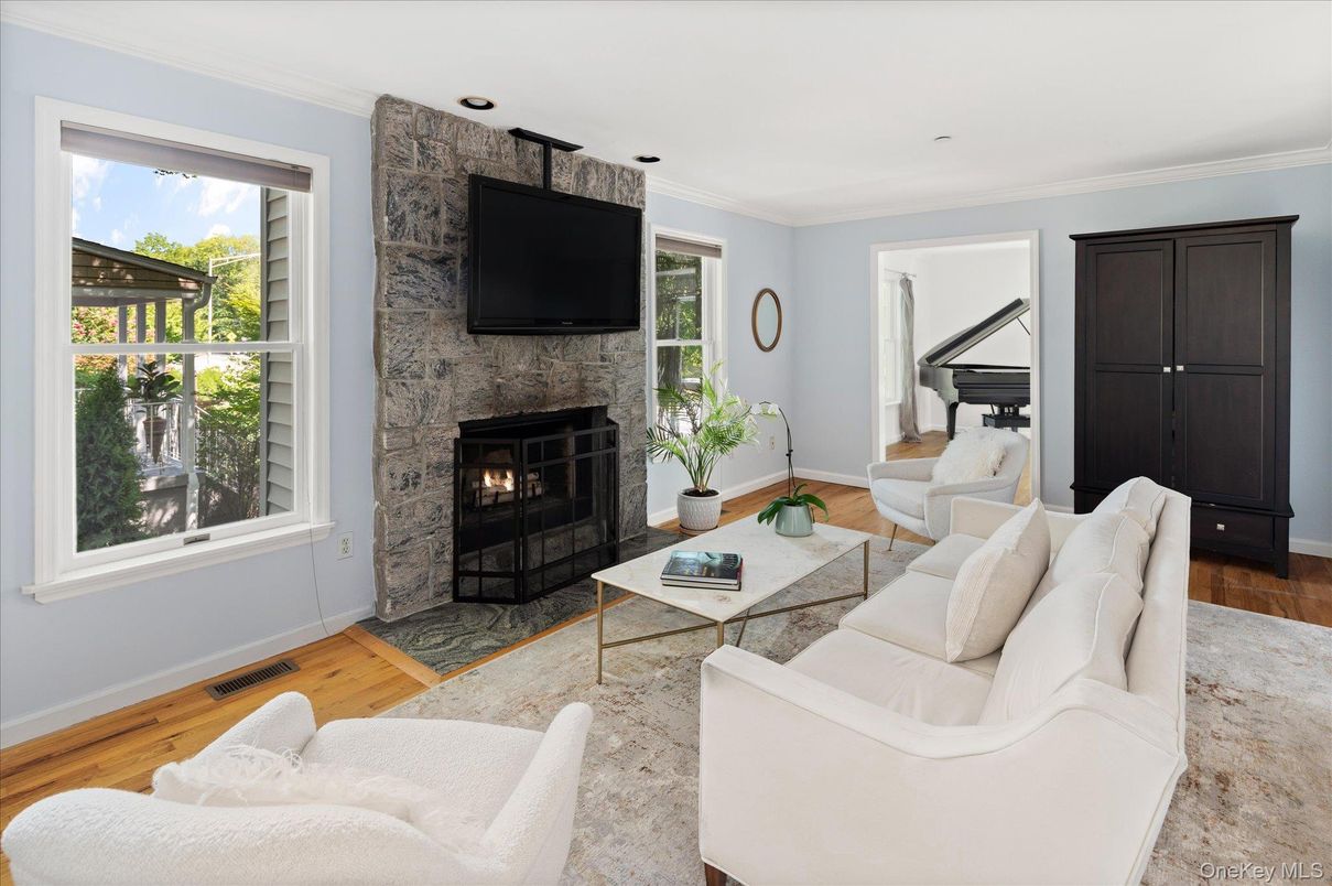 Fireplace, Interior, Living room, Piano, Recessed Lighting, Wood Texture Flooring