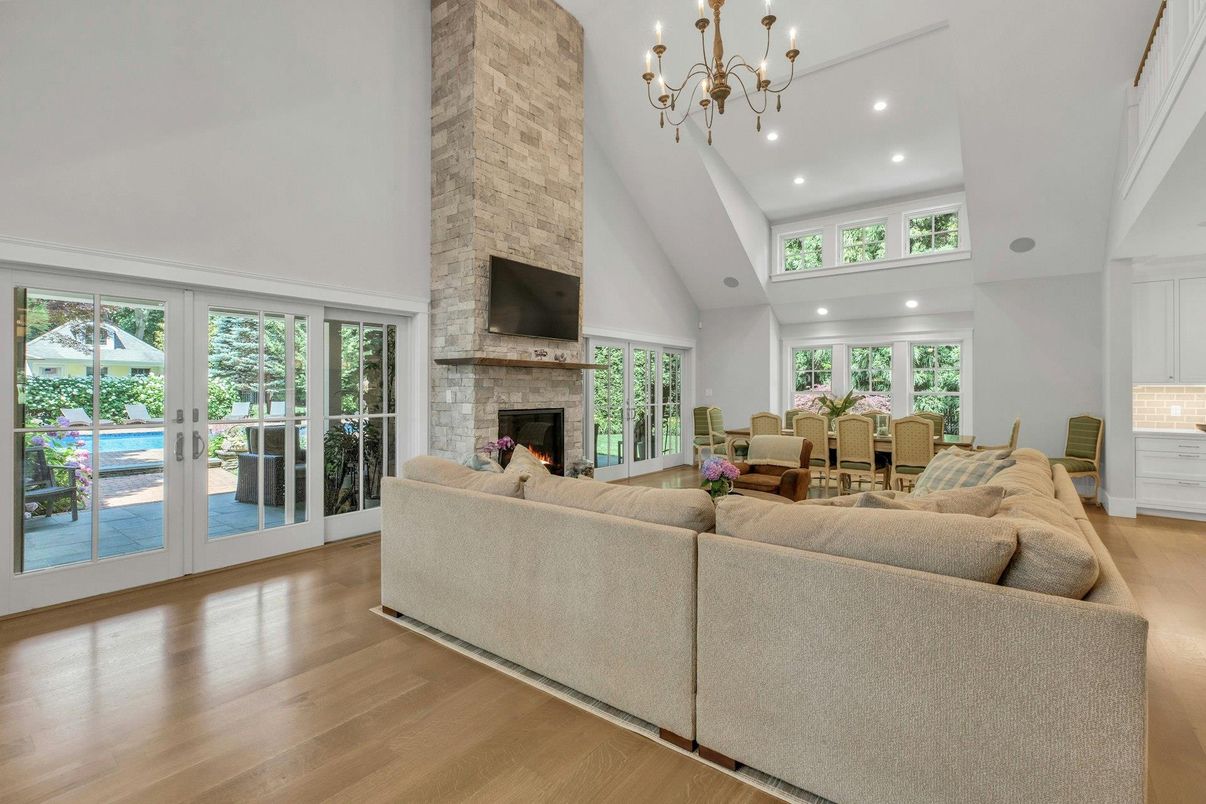 Chandelier, Dining room, Fireplace, Interior, Living room, Pendant Lights, Recessed Lighting, Wood Texture Flooring