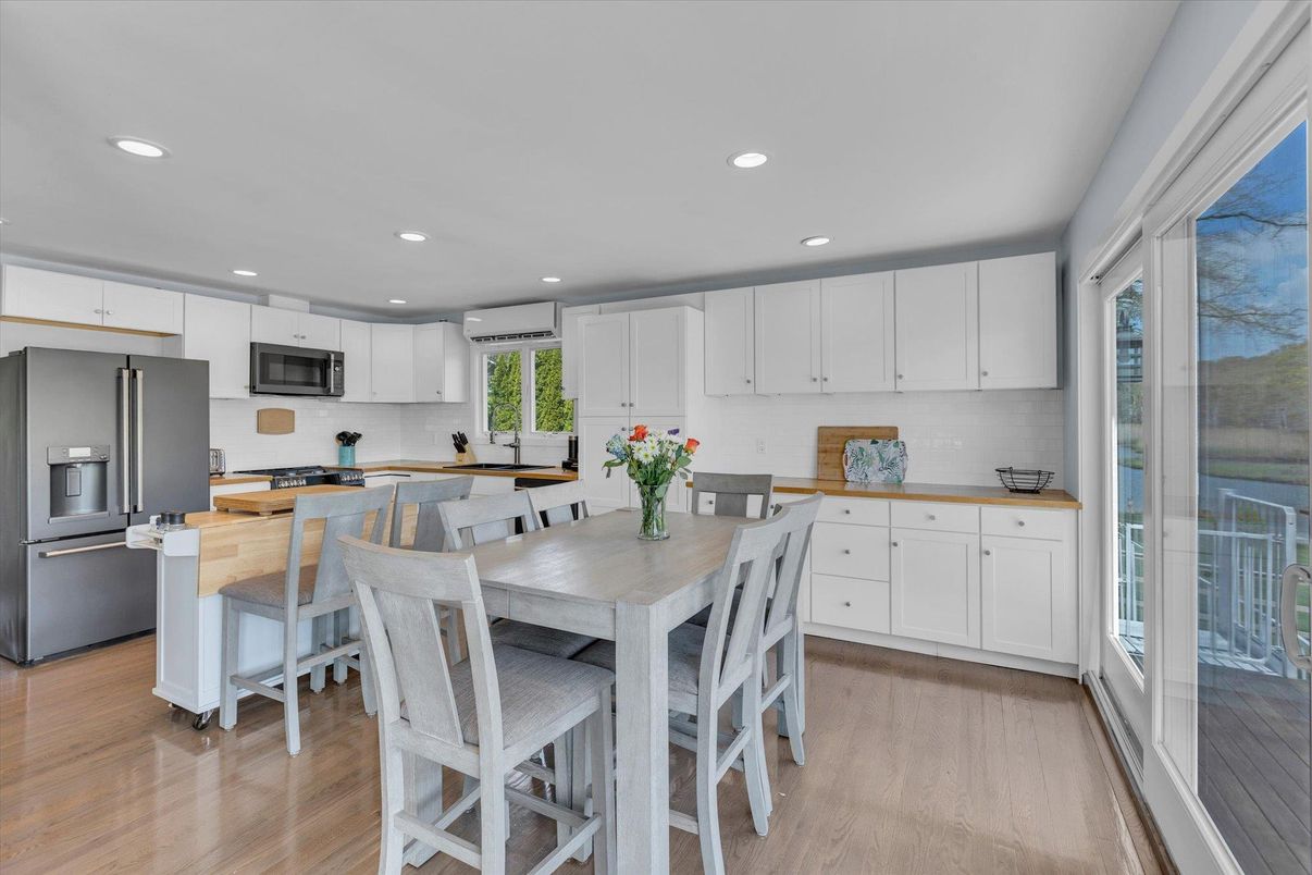 Dining room, Interior, Kitchen, Recessed Lighting, Stainless Steel Appliances, Wood Texture Flooring