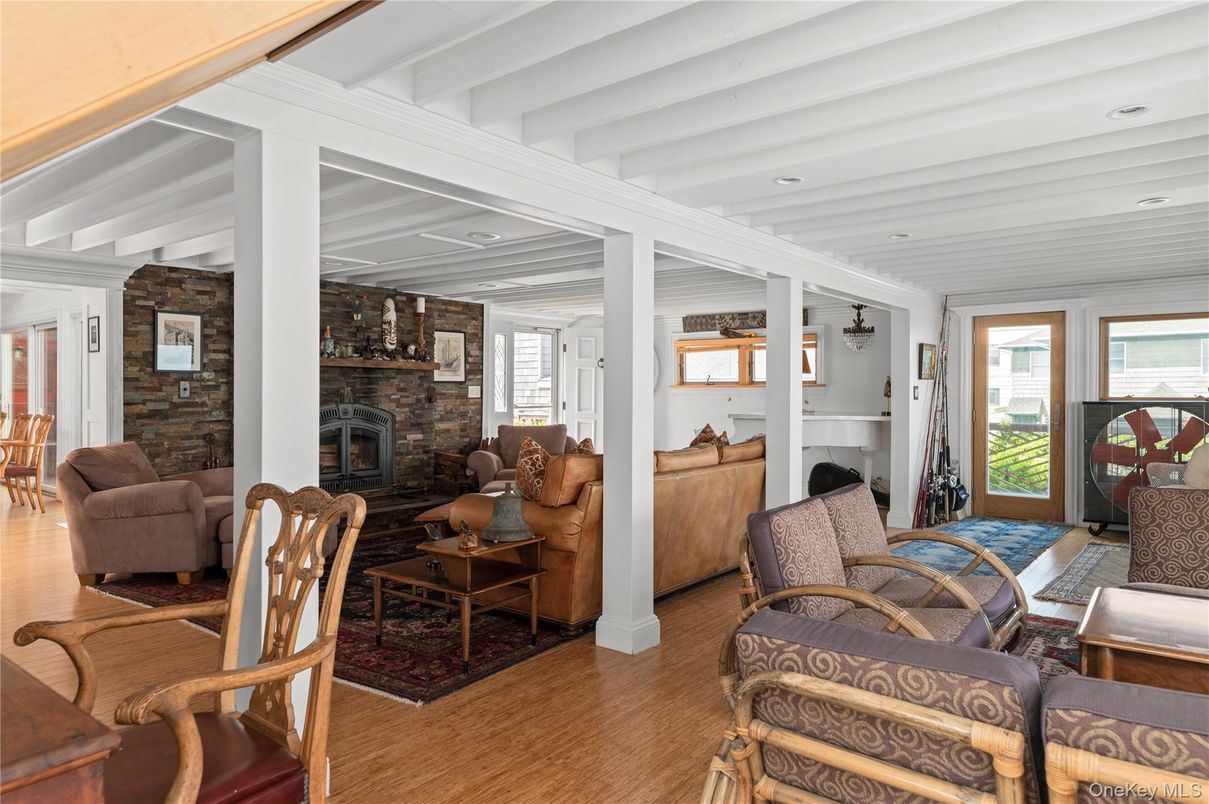 Fireplace, Interior, Living room, Recessed Lighting, Stone Walls, Wood Texture Flooring