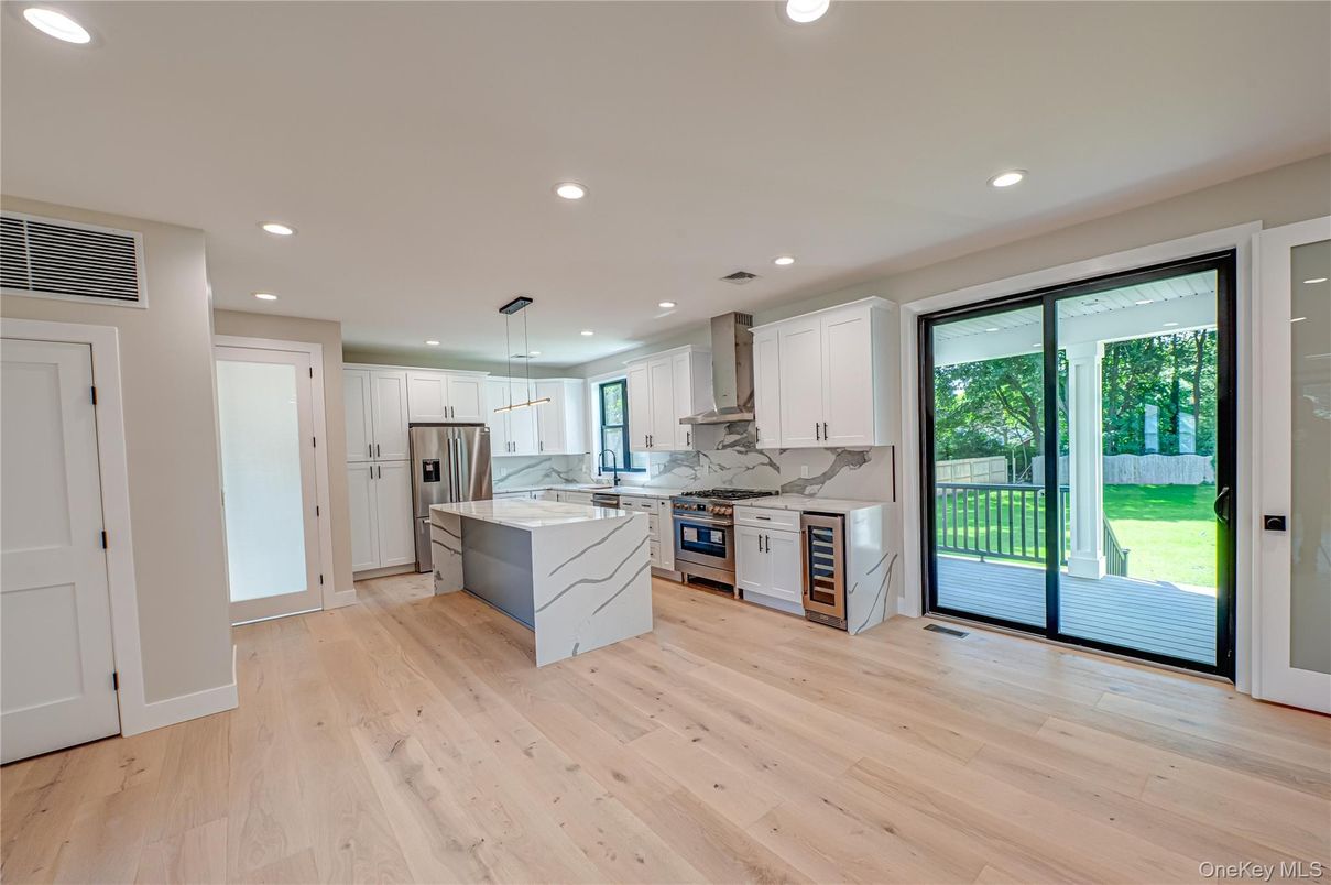 Interior, Kitchen, Marble Walls, Pendant Lights, Recessed Lighting, Stainless Steel Appliances, Wood Texture Flooring