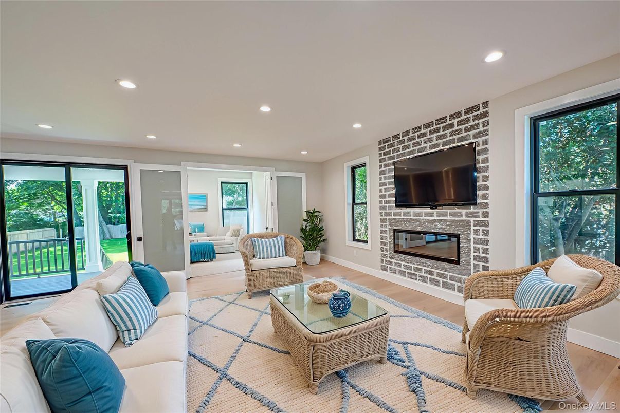 Fireplace, Interior, Living room, Recessed Lighting, Stone Walls, Wood Texture Flooring