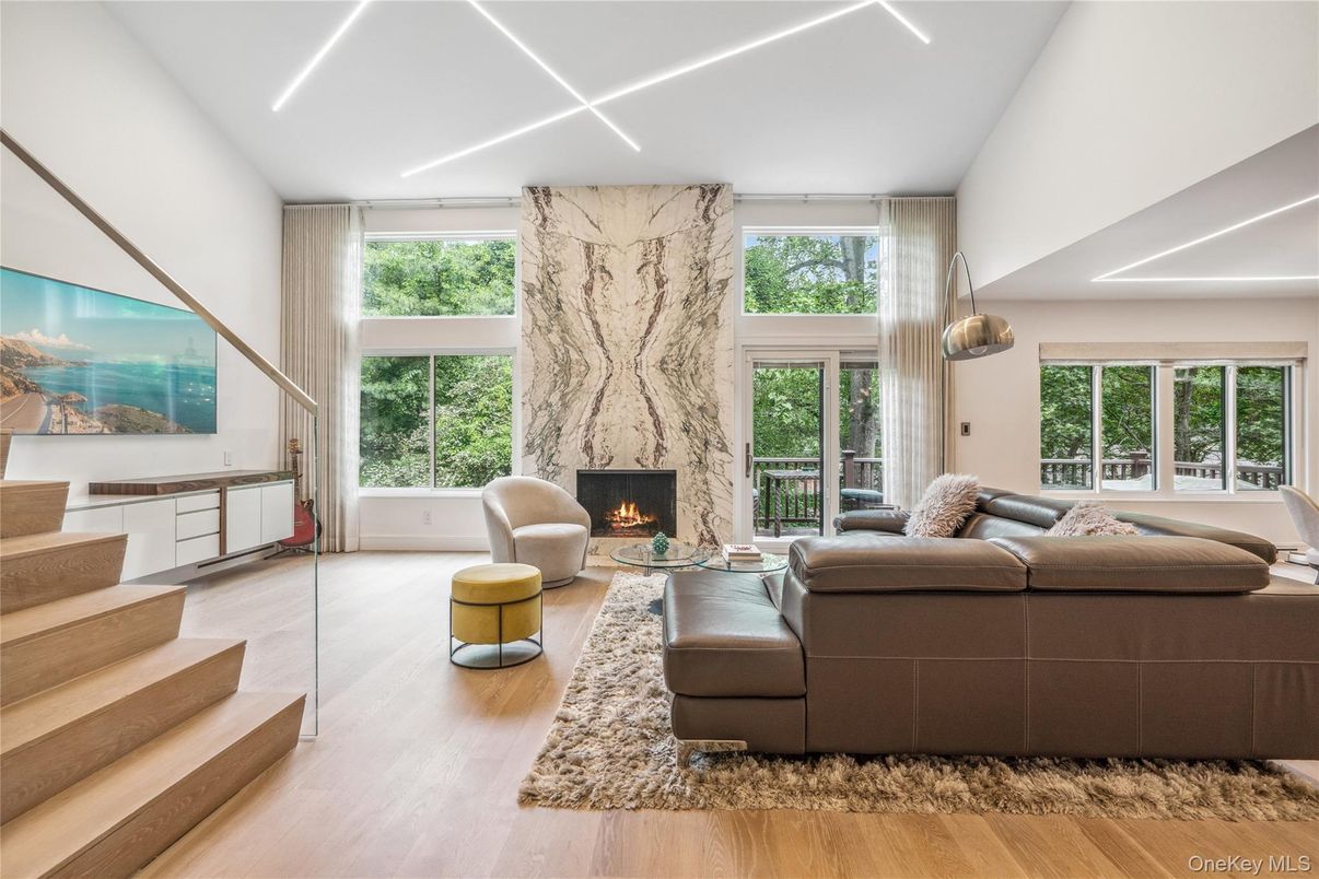 Fireplace, Interior, Living room, Marble Walls, Recessed Lighting, Wood Texture Flooring