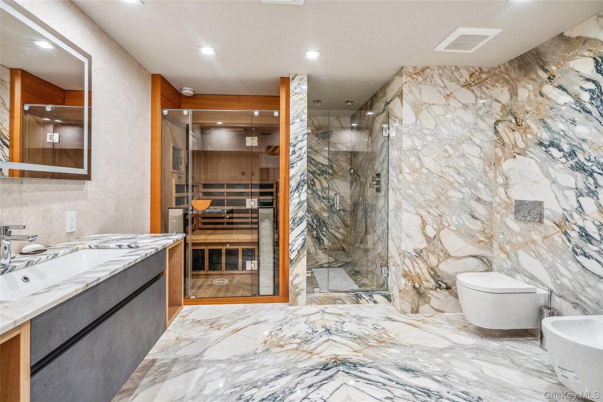Bathroom, Dual Sink Vanities, Interior, Marble, Marble Walls, Recessed Lighting, Sauna Room