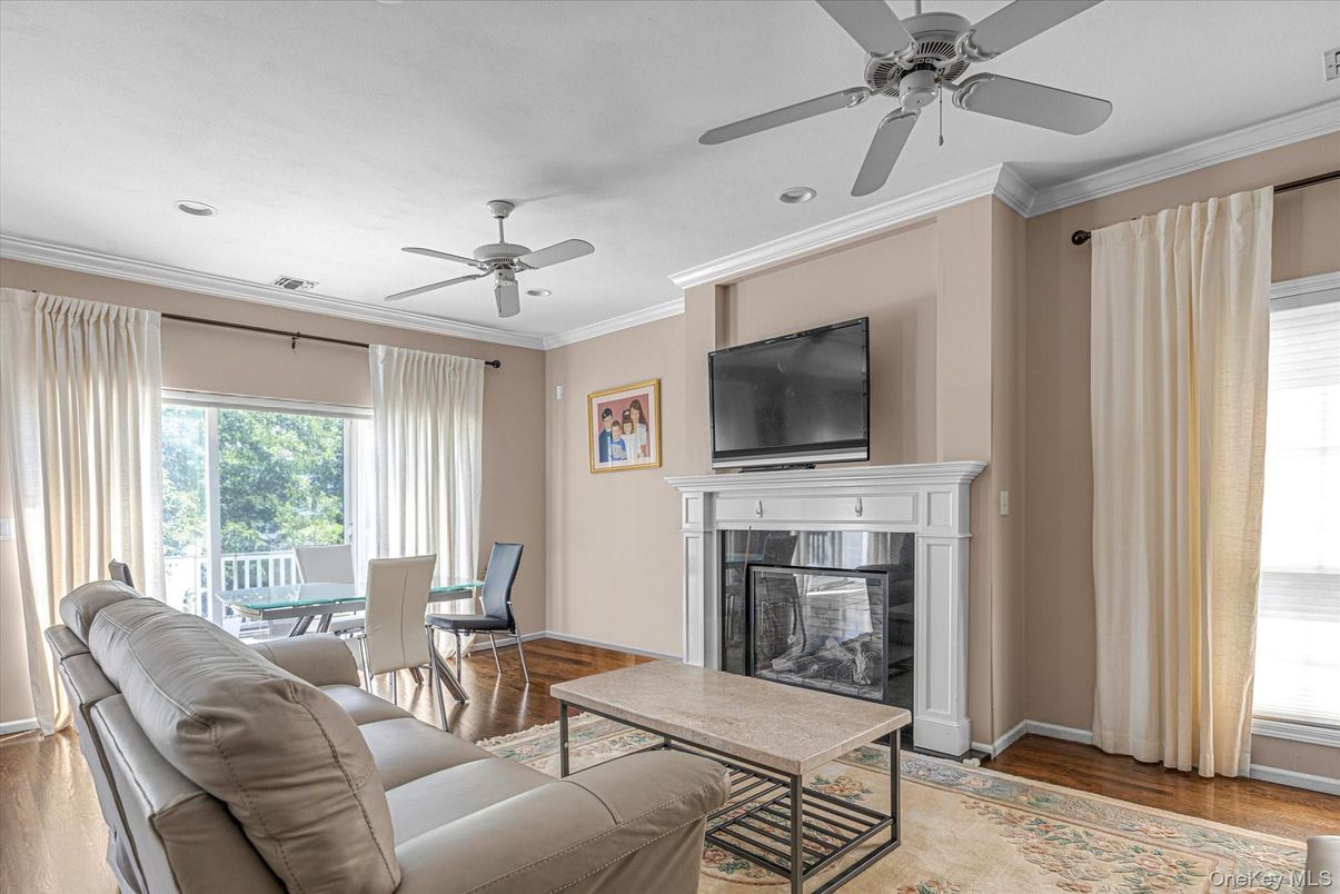Dining room, Fireplace, Interior, Living room, Recessed Lighting, Wood Texture Flooring