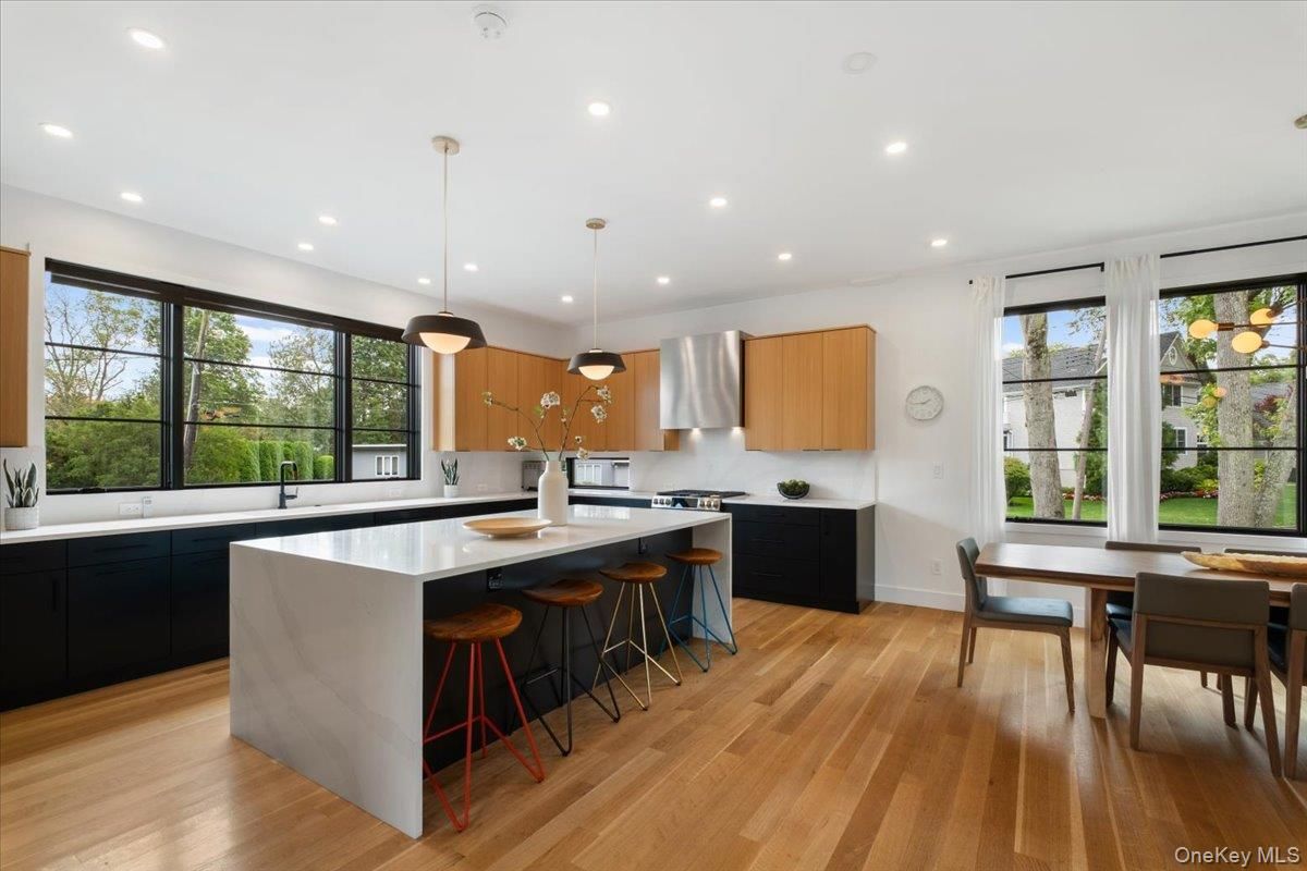 Dining room, Interior, Kitchen, Pendant Lights, Recessed Lighting, Stainless Steel Appliances, Wood Texture Flooring