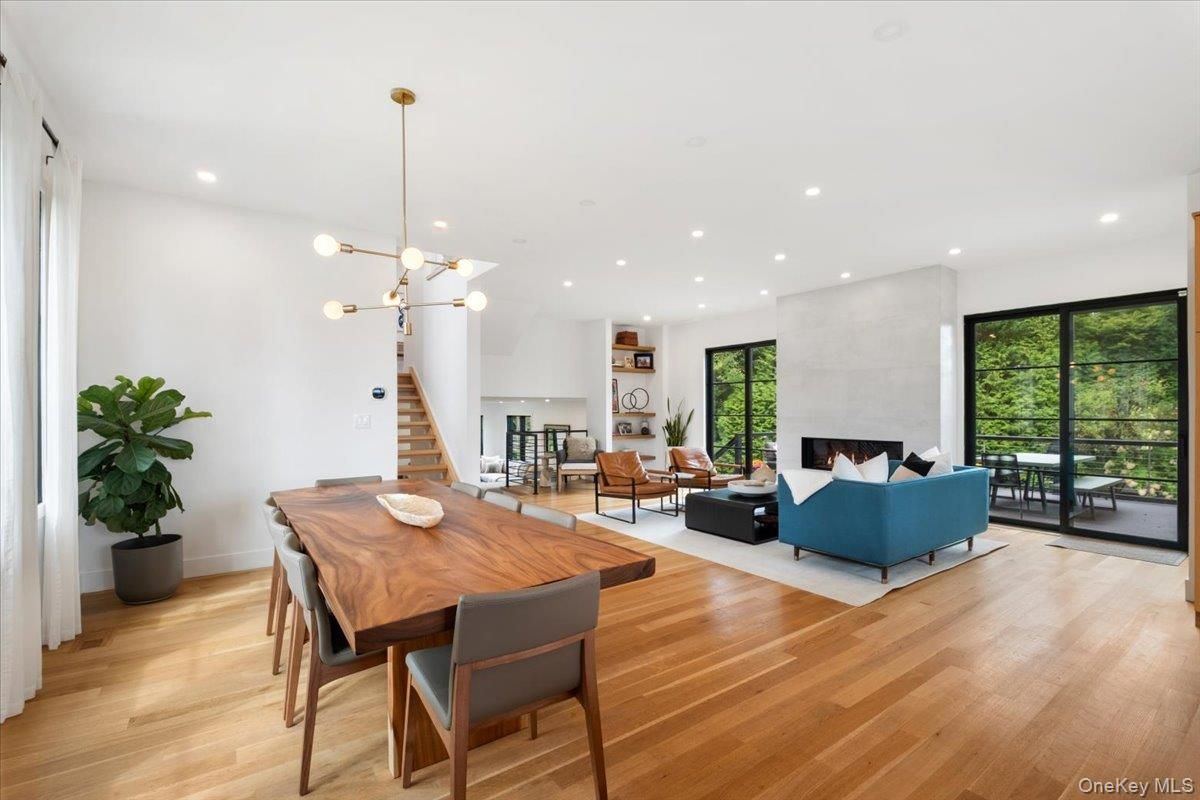 Dining room, Fireplace, Interior, Living room, Pendant Lights, Recessed Lighting, Wood Texture Flooring