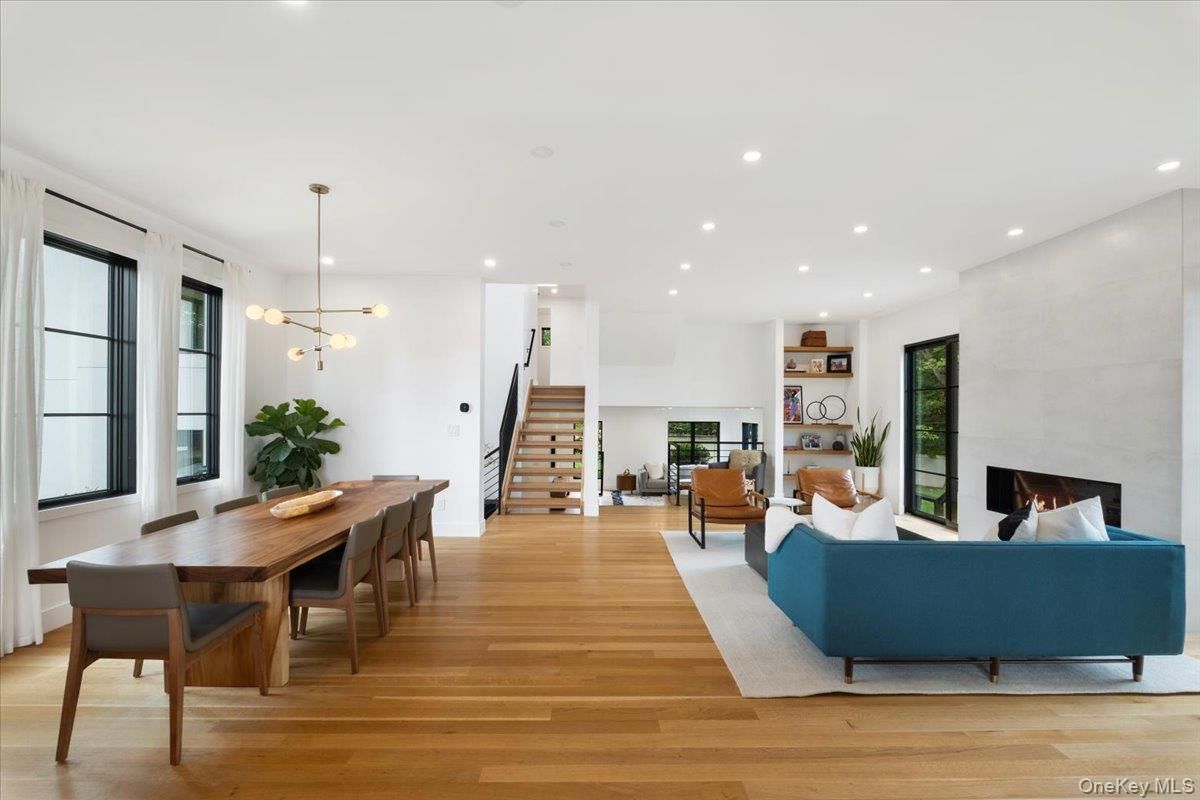Dining room, Fireplace, Interior, Living room, Pendant Lights, Recessed Lighting, Wood Texture Flooring