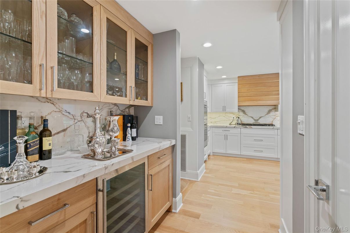 Interior, Kitchen, Marble Walls, Recessed Lighting, Stainless Steel Appliances, Wood Texture Flooring