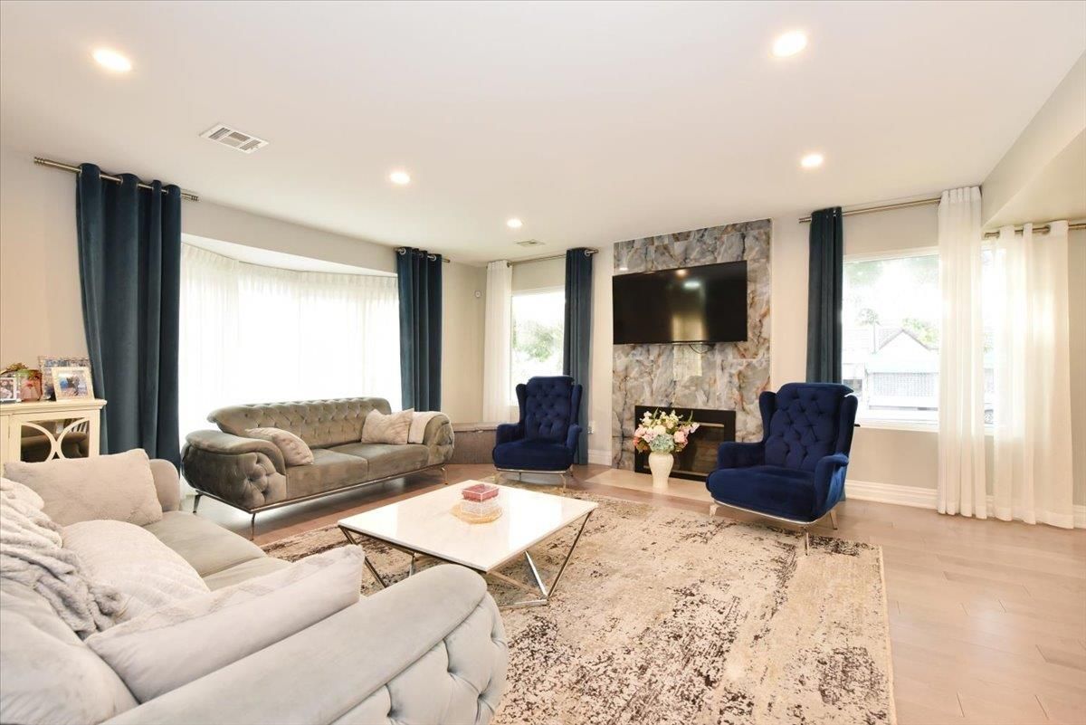 Fireplace, Interior, Living room, Recessed Lighting, Stone Walls, Wood Texture Flooring