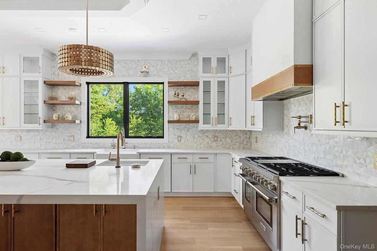 Interior, Kitchen, Marble Walls, Pendant Lights, Recessed Lighting, Stainless Steel Appliances, Wood Texture Flooring