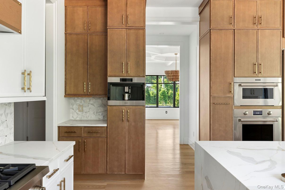 Interior, Kitchen, Marble Walls, Pendant Lights, Stainless Steel Appliances, Wood Texture Flooring