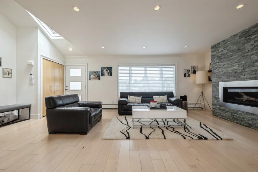 Fireplace, Interior, Living room, Recessed Lighting, Stone Walls, Wood Texture Flooring