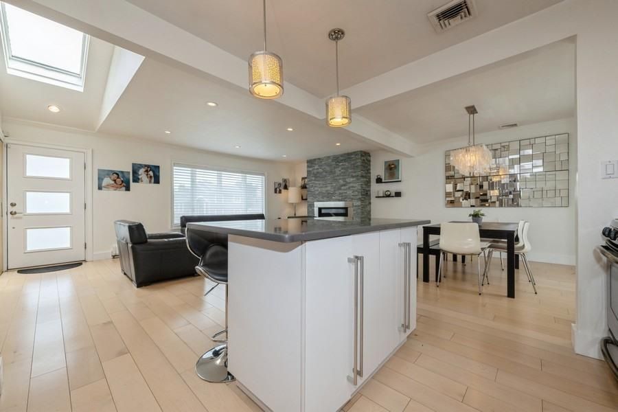 Chandelier, Dining room, Fireplace, Interior, Living room, Pendant Lights, Recessed Lighting, Stone Walls, Wood Texture Flooring