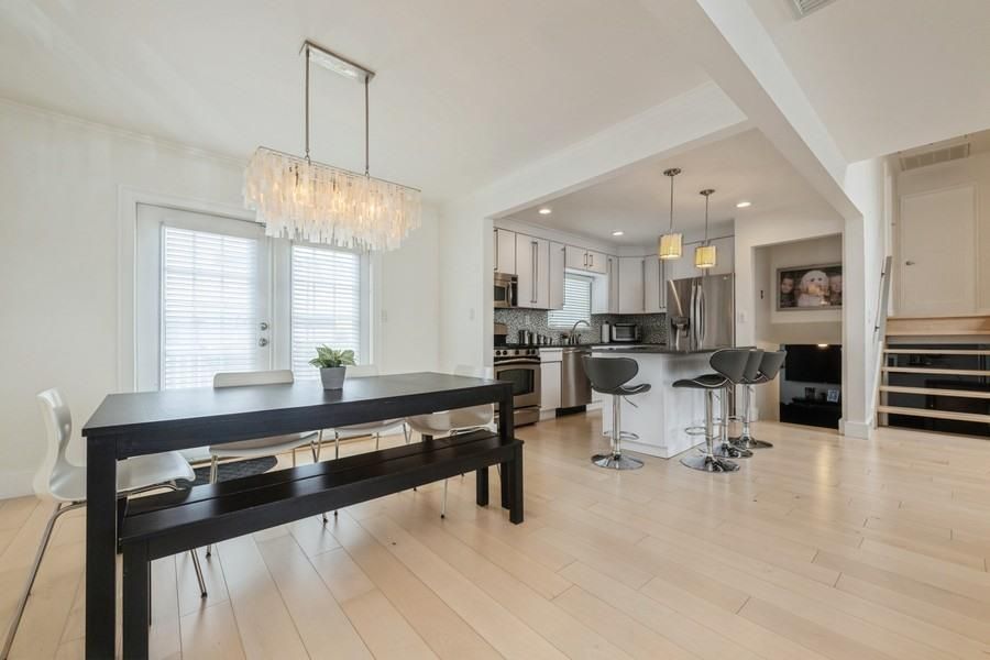 Chandelier, Dining room, Interior, Kitchen, Pendant Lights, Recessed Lighting, Stainless Steel Appliances, Wood Texture Flooring