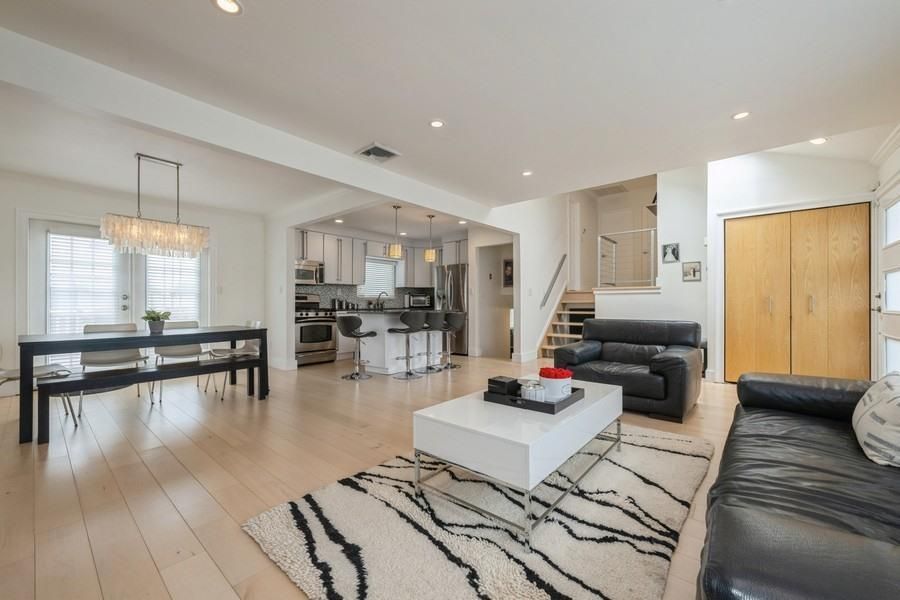 Chandelier, Dining room, Interior, Kitchen, Living room, Pendant Lights, Recessed Lighting, Stainless Steel Appliances, Wood Texture Flooring