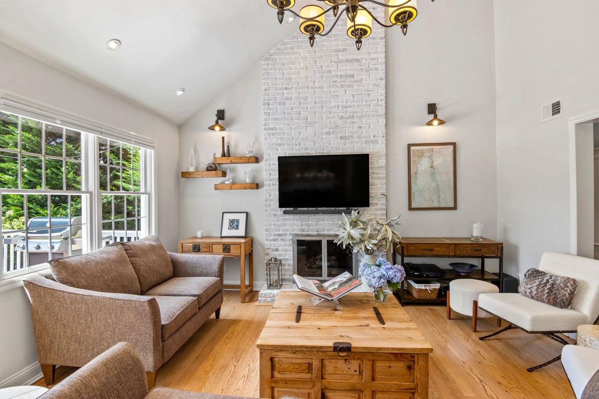 Fireplace, Interior, Living room, Recessed Lighting, Stone Walls, Wood Texture Flooring