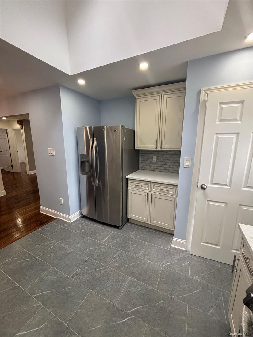 Interior, Kitchen, Recessed Lighting, Washer, Wood Texture Flooring