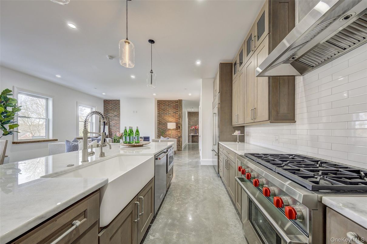 Fireplace, Interior, Kitchen, Pendant Lights, Recessed Lighting, Stainless Steel Appliances, Stone Walls