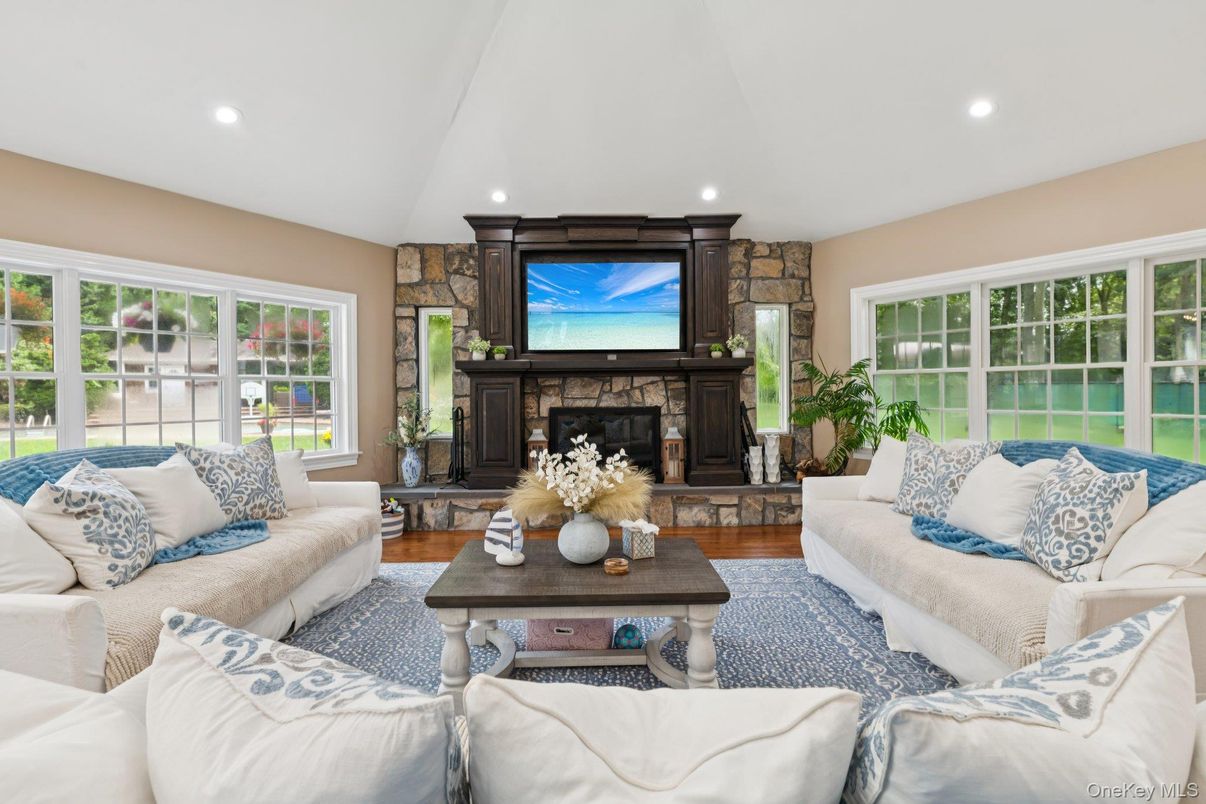 Fireplace, Interior, Living room, Recessed Lighting, Stone Walls, Wood Texture Flooring