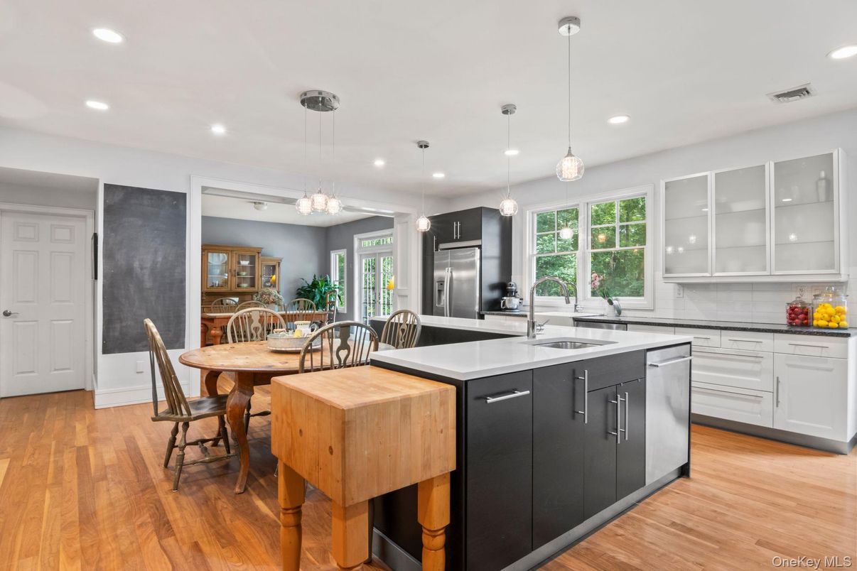 Dining room, Interior, Kitchen, Pendant Lights, Recessed Lighting, Stainless Steel Appliances, Wood Texture Flooring