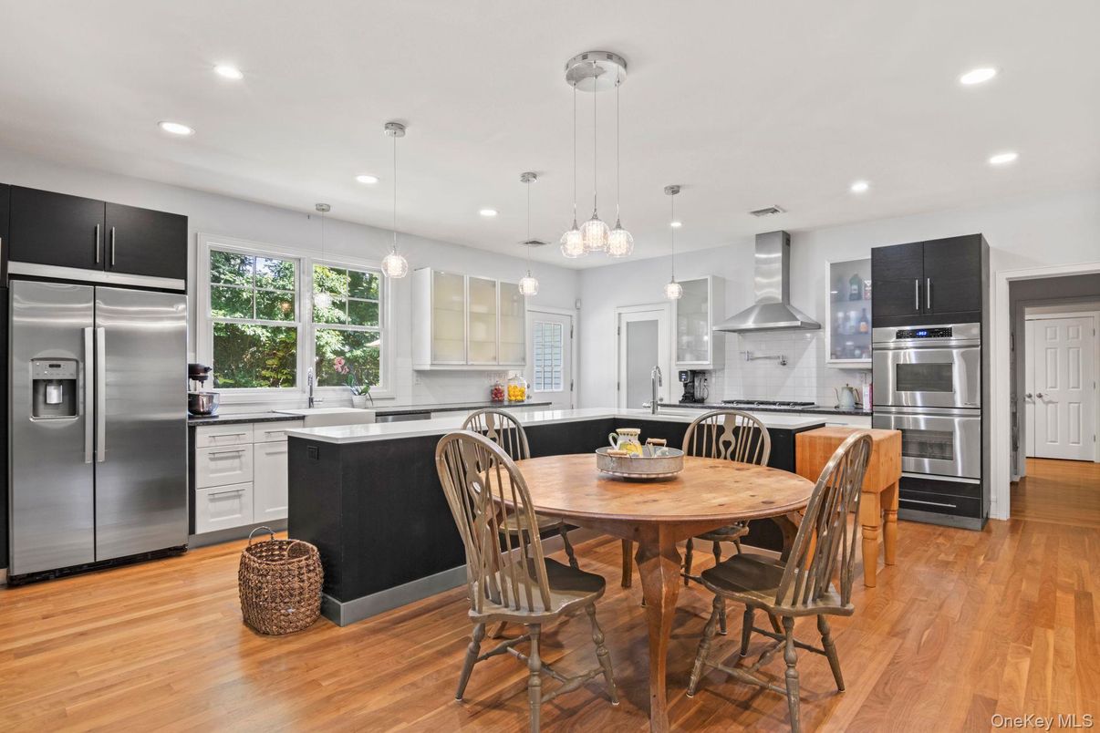 Dining room, Interior, Kitchen, Pendant Lights, Recessed Lighting, Stainless Steel Appliances, Wood Texture Flooring