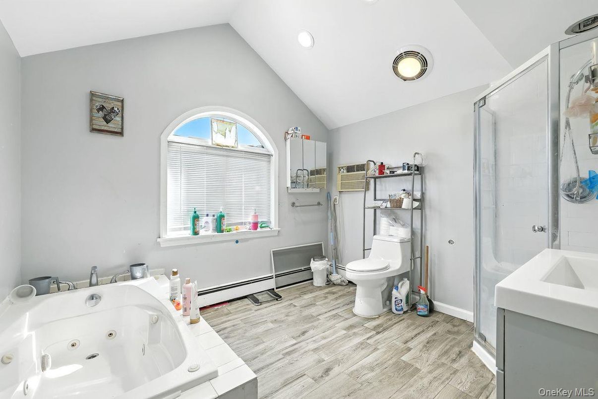 Bathroom, Dual Sink Vanities, Glass Shower, Interior, Recessed Lighting, Wood Texture Flooring