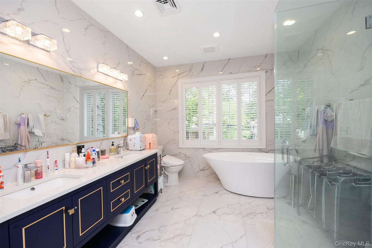 Bathroom, Dual Sink Vanities, Free Standing Baths, Glass Shower, Interior, Marble, Marble Walls, Recessed Lighting
