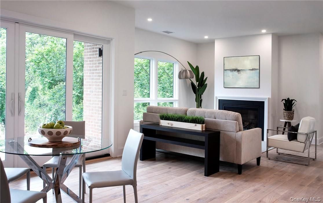 Dining room, Fireplace, Interior, Living room, Recessed Lighting, Wood Texture Flooring