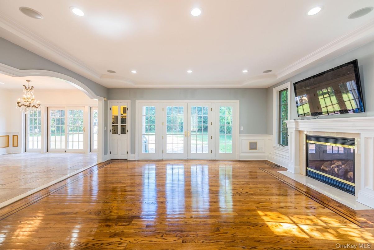 Chandelier, Empty room, Fireplace, Interior, Recessed Lighting, Wood Texture Flooring