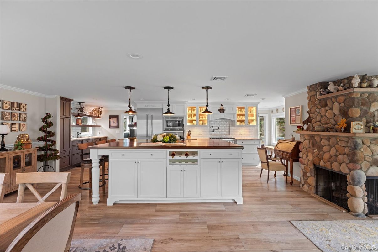 Dining room, Fireplace, Interior, Kitchen, Pendant Lights, Recessed Lighting, Wood Texture Flooring