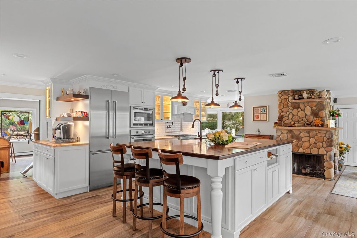 Fireplace, Interior, Kitchen, Pendant Lights, Recessed Lighting, Stainless Steel Appliances, Wood Texture Flooring