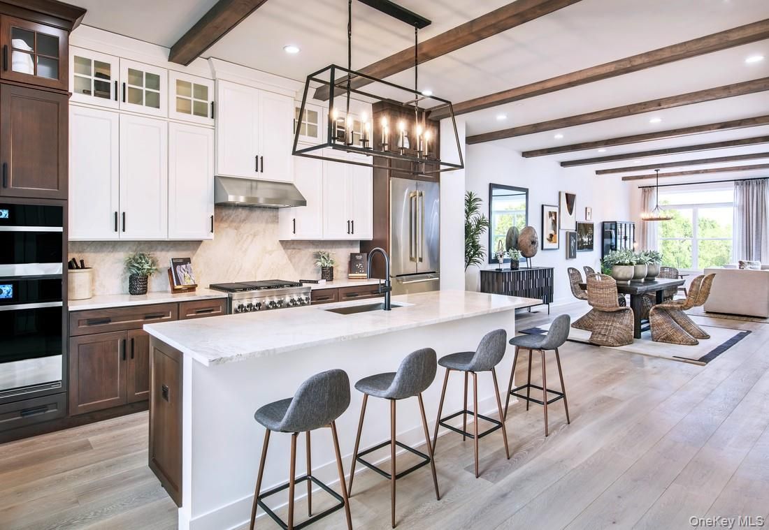 Chandelier, Dining room, Interior, Kitchen, Pendant Lights, Recessed Lighting, Stainless Steel Appliances, Wooden Beams, Wood Texture Flooring