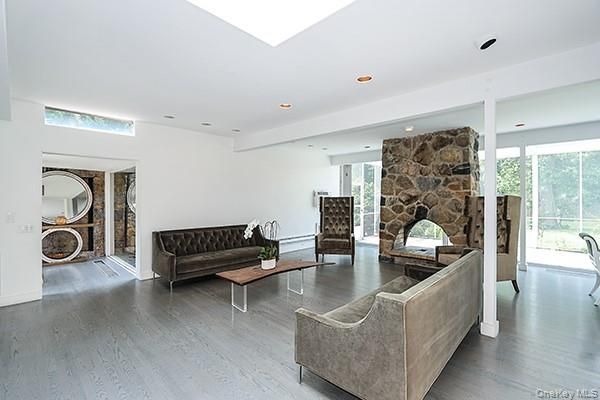 Fireplace, Interior, Living room, Recessed Lighting, Stone Walls, Wood Texture Flooring