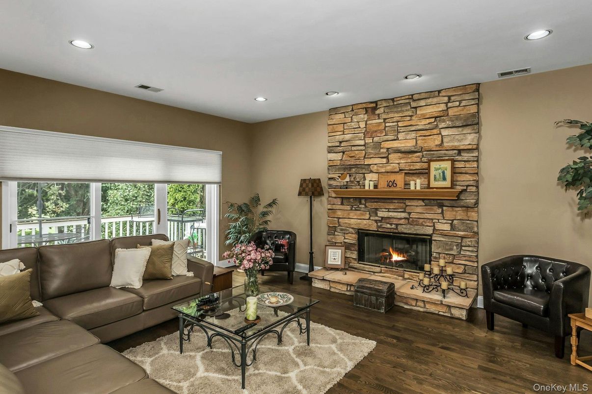 Fireplace, Interior, Living room, Recessed Lighting, Stone Walls, Wood Texture Flooring