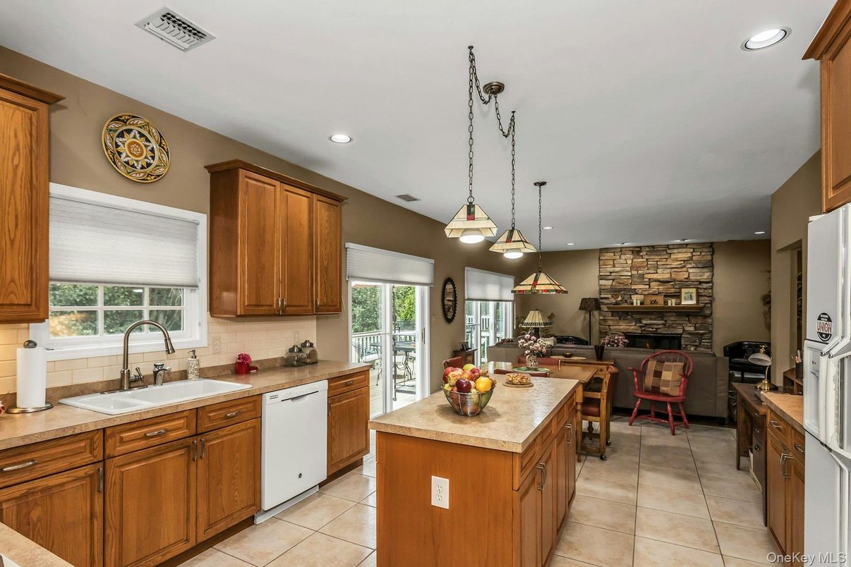 Dining room, Fireplace, Interior, Kitchen, Pendant Lights, Recessed Lighting, Stainless Steel Appliances, Stone Walls