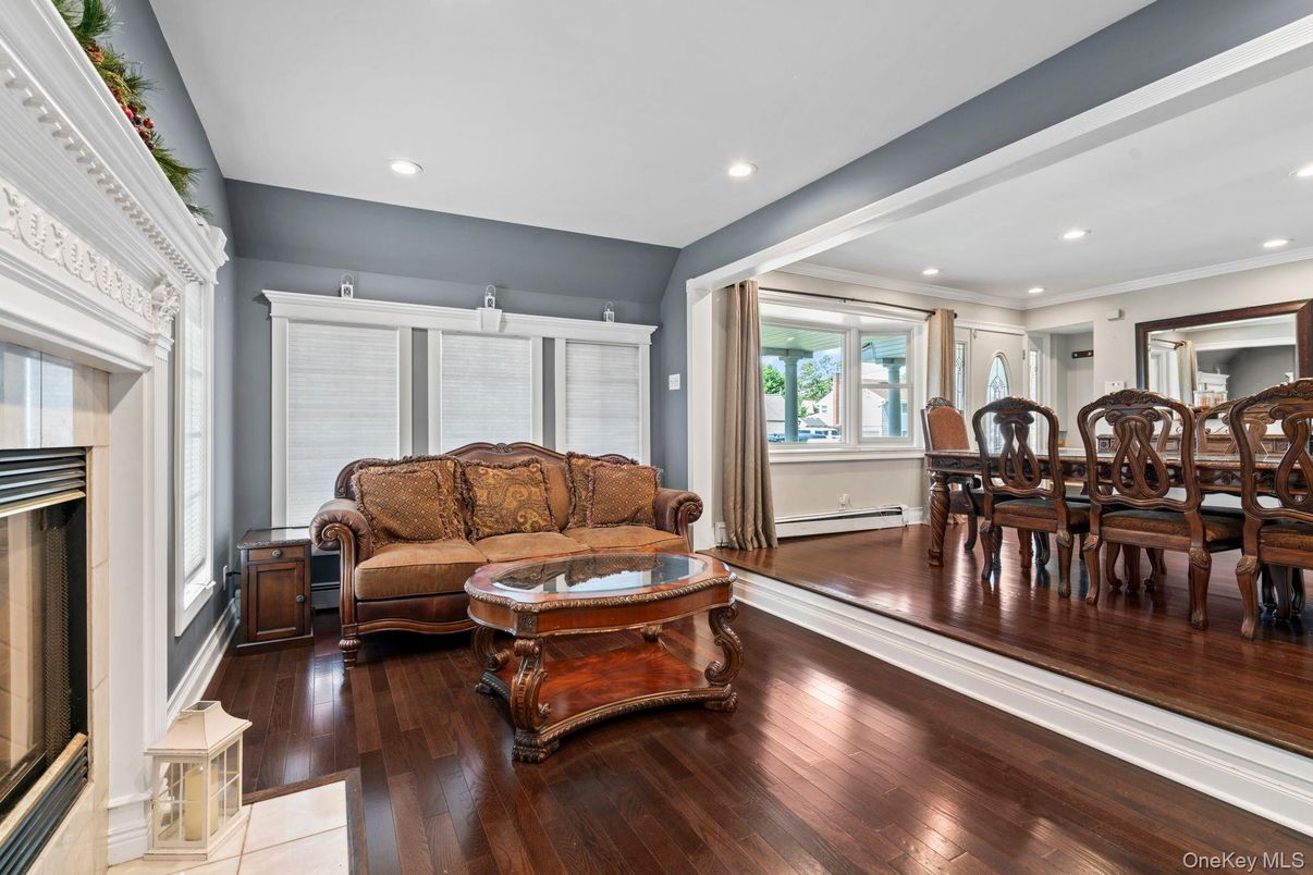 Dining room, Fireplace, Interior, Living room, Recessed Lighting, Wood Texture Flooring