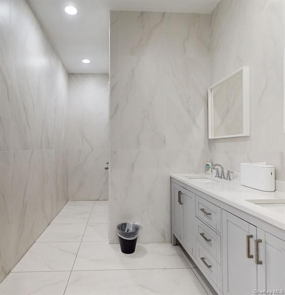 Bathroom, Dual Sink Vanities, Interior, Marble, Marble Walls, Recessed Lighting