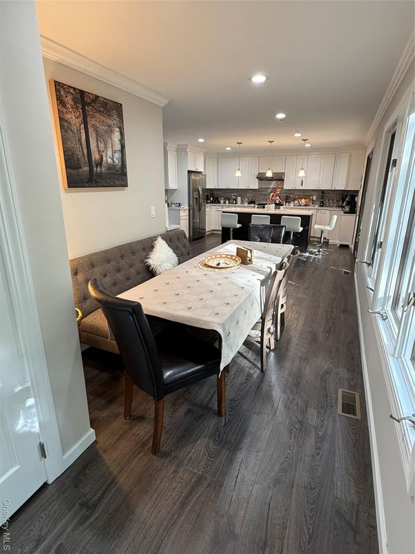 Dining room, Interior, Kitchen, Pendant Lights, Recessed Lighting, Stainless Steel Appliances, Wood Texture Flooring