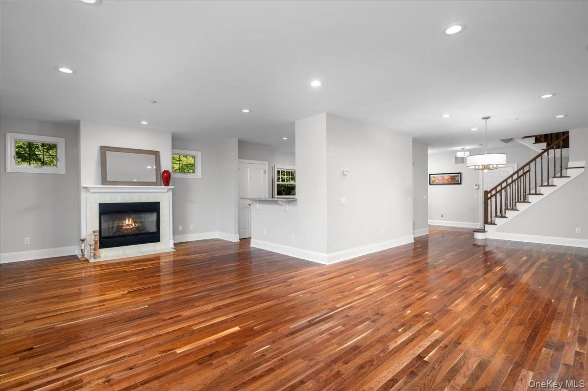 Empty room, Fireplace, Interior, Pendant Lights, Recessed Lighting, Wood Texture Flooring