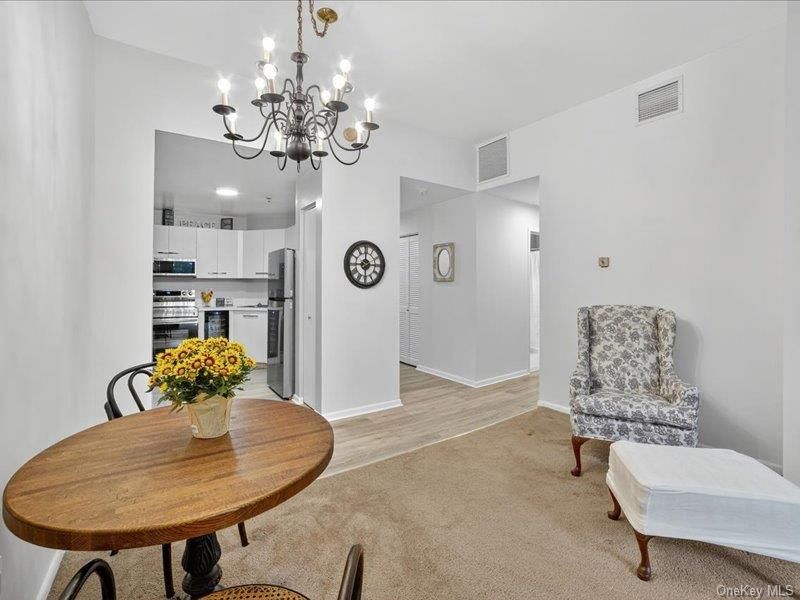 Chandelier, Dining room, Interior, Kitchen, Stainless Steel Appliances, Wood Texture Flooring