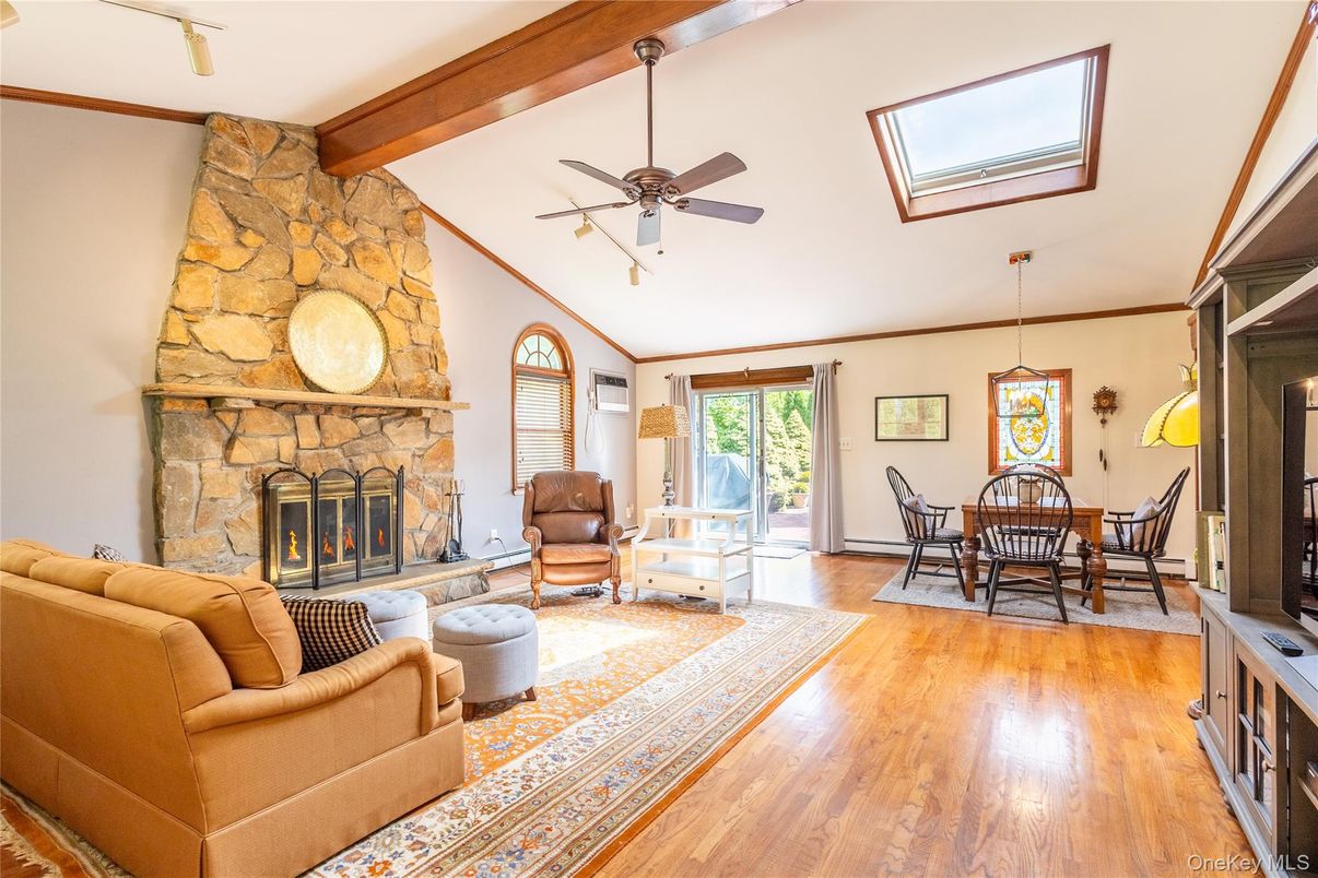 Dining room, Fireplace, Interior, Living room, Pendant Lights, Stone Walls, Wooden Beams, Wood Texture Flooring