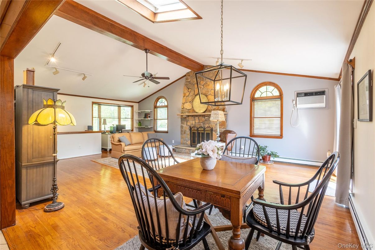 Dining room, Fireplace, Interior, Living room, Pendant Lights, Wooden Beams, Wood Texture Flooring